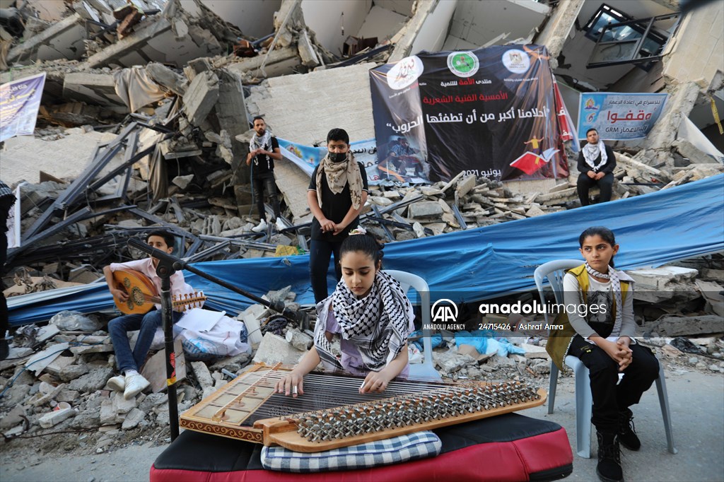 Palestinian musicians in Gaza perform concert in front of debris of buildings