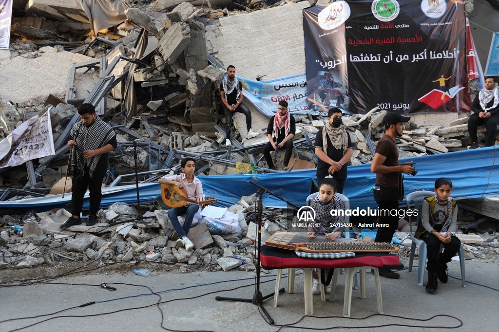Palestinian musicians in Gaza perform concert in front of debris of buildings