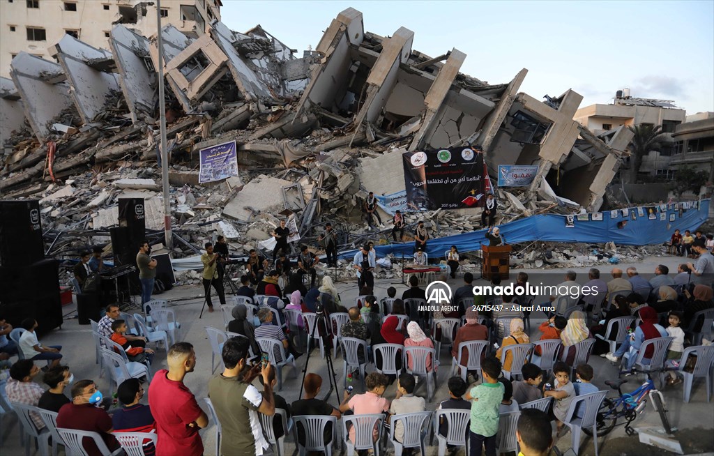 Palestinian musicians in Gaza perform concert in front of debris of buildings
