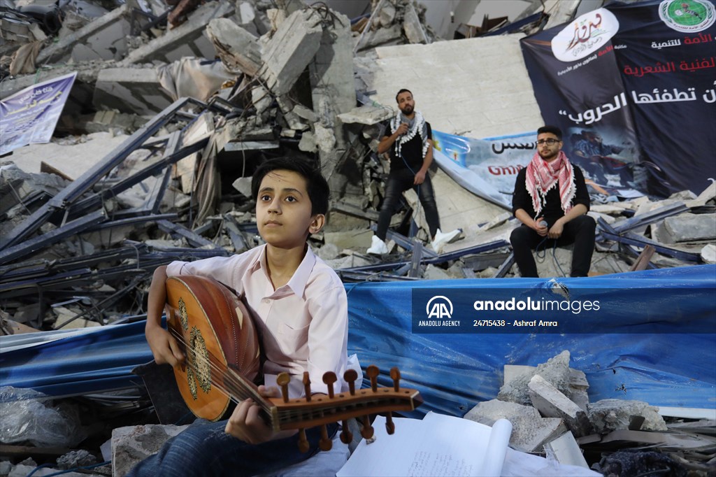 Palestinian musicians in Gaza perform concert in front of debris of buildings