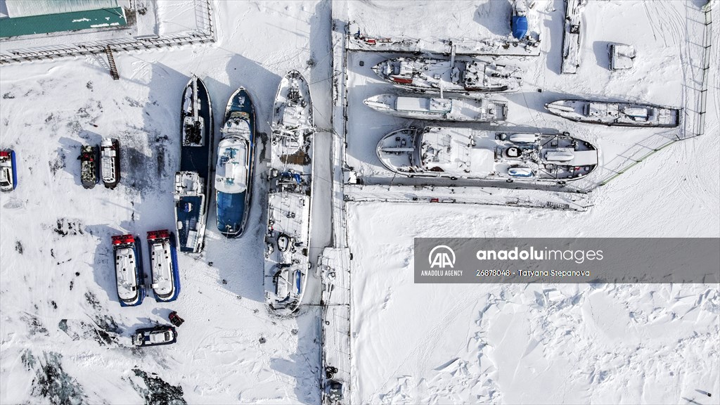 Boats and ships stranded on the frozen Lake Baikal
