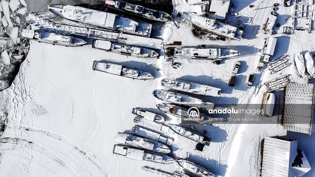 Boats and ships stranded on the frozen Lake Baikal