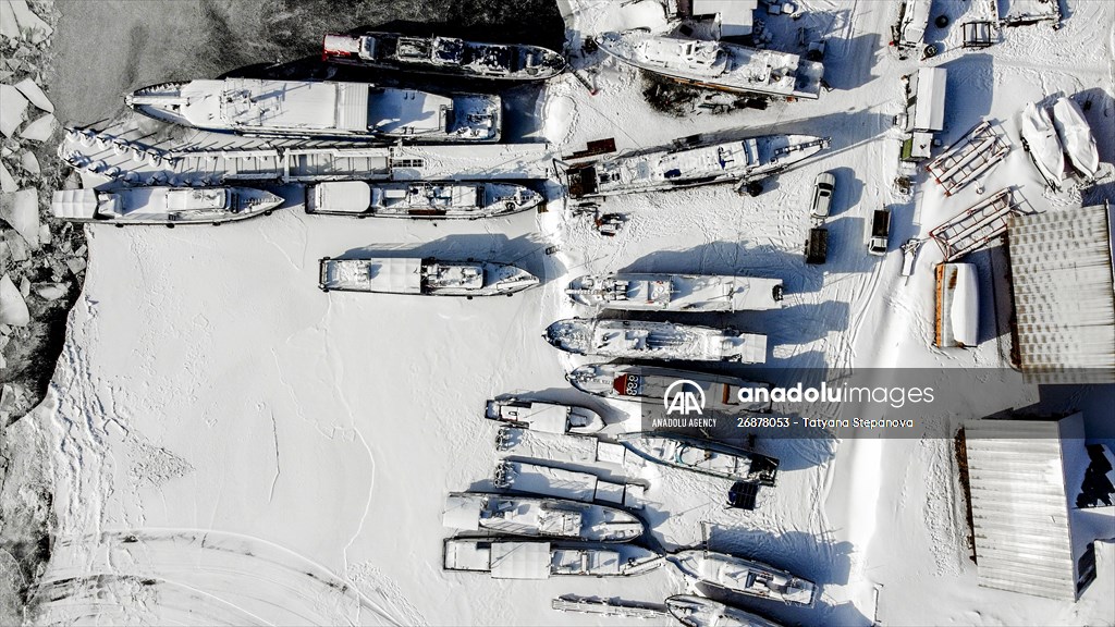 Boats and ships stranded on the frozen Lake Baikal