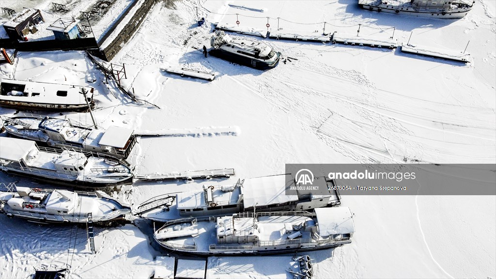 Boats and ships stranded on the frozen Lake Baikal