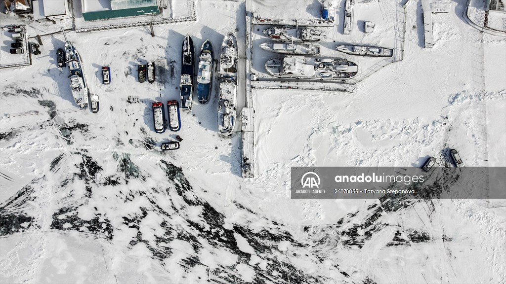 Boats and ships stranded on the frozen Lake Baikal