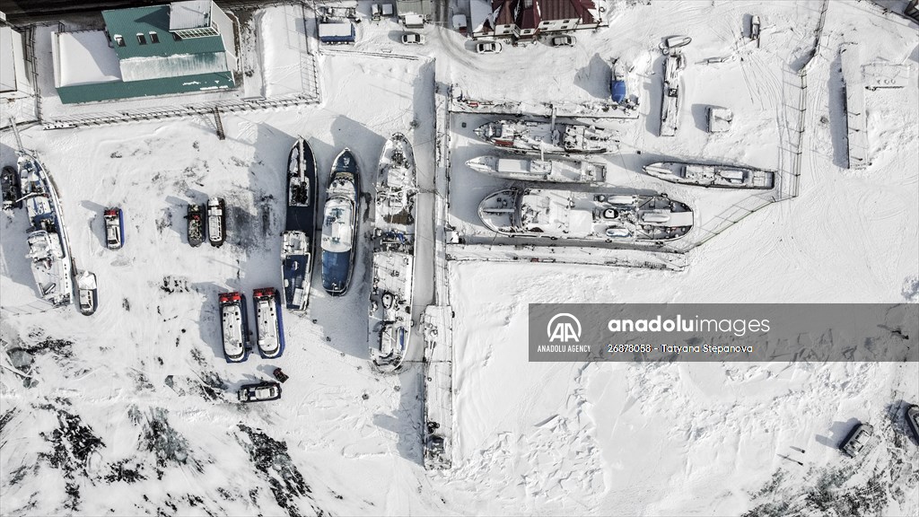 Boats and ships stranded on the frozen Lake Baikal