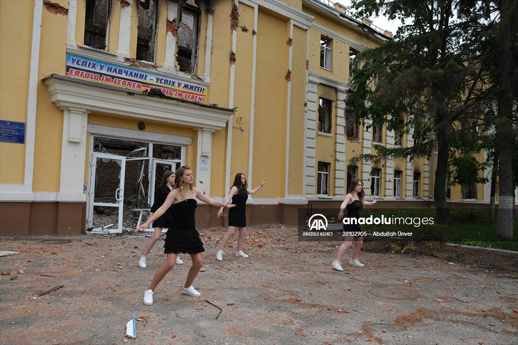 Students in Kharkiv return to ruined school in prom dresses