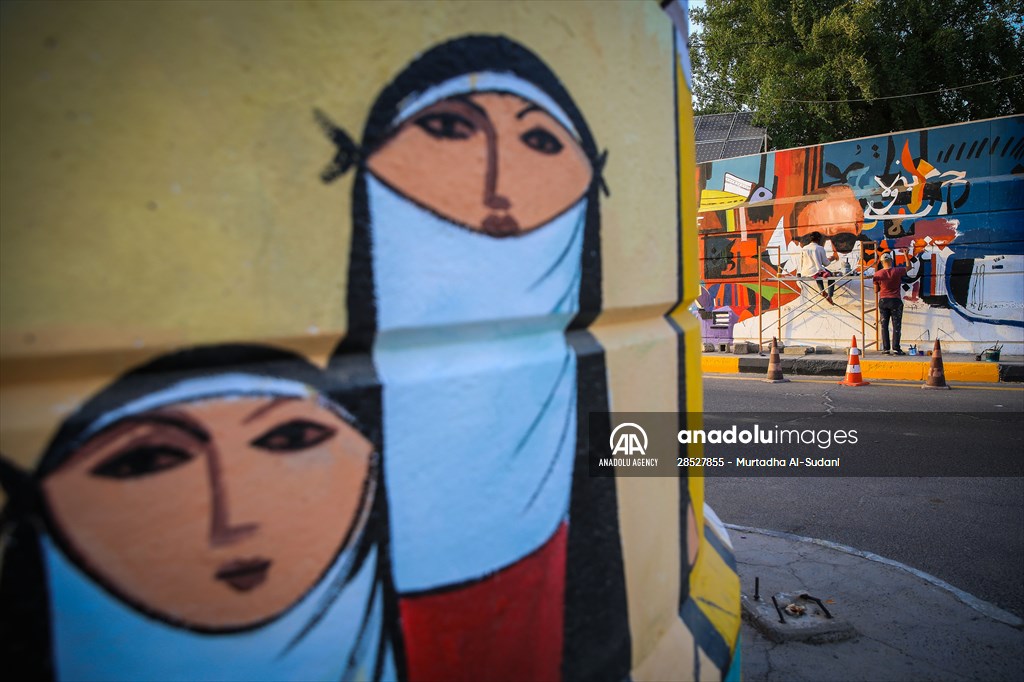 The walls of Baghdad are colored by murals of Iraqi artists