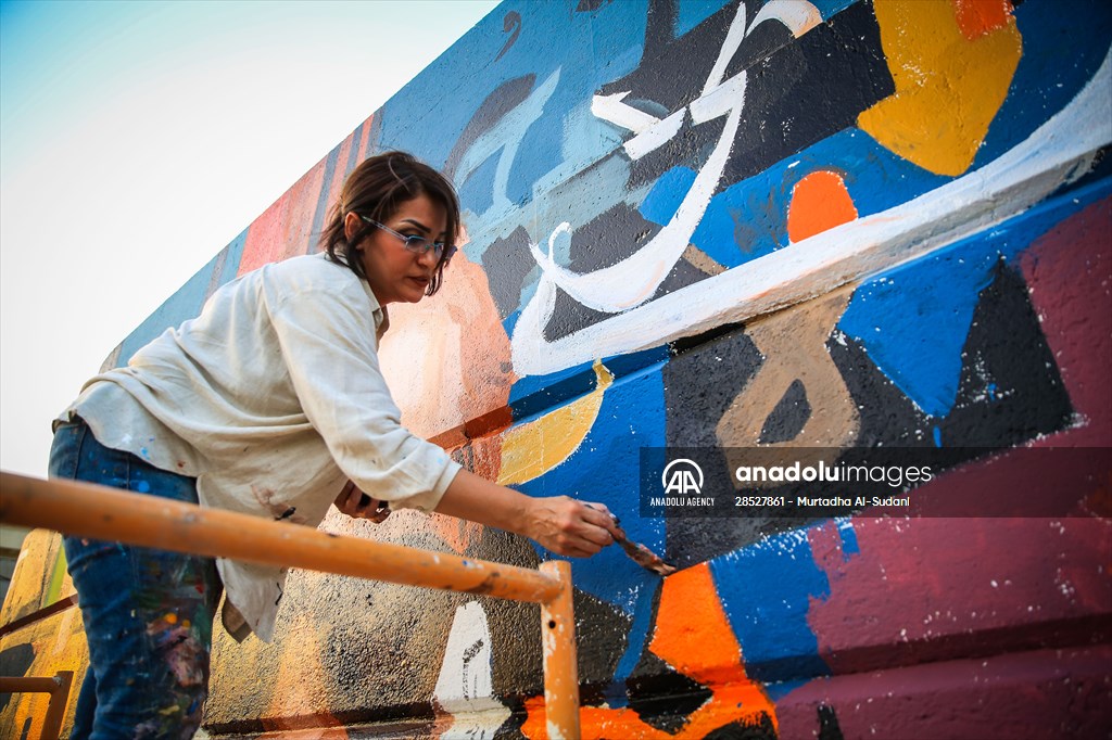 The walls of Baghdad are colored by murals of Iraqi artists