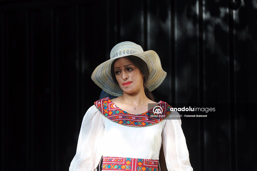 Acid attack victims model for Iranian fashion designer