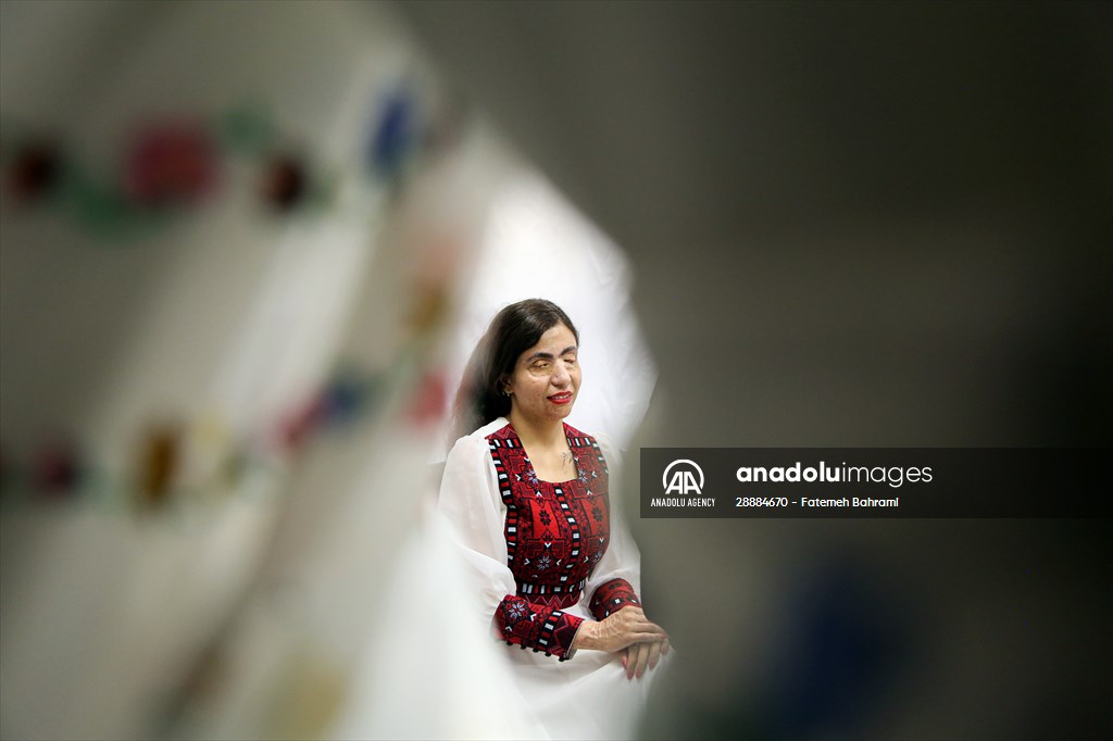 Acid attack victims model for Iranian fashion designer