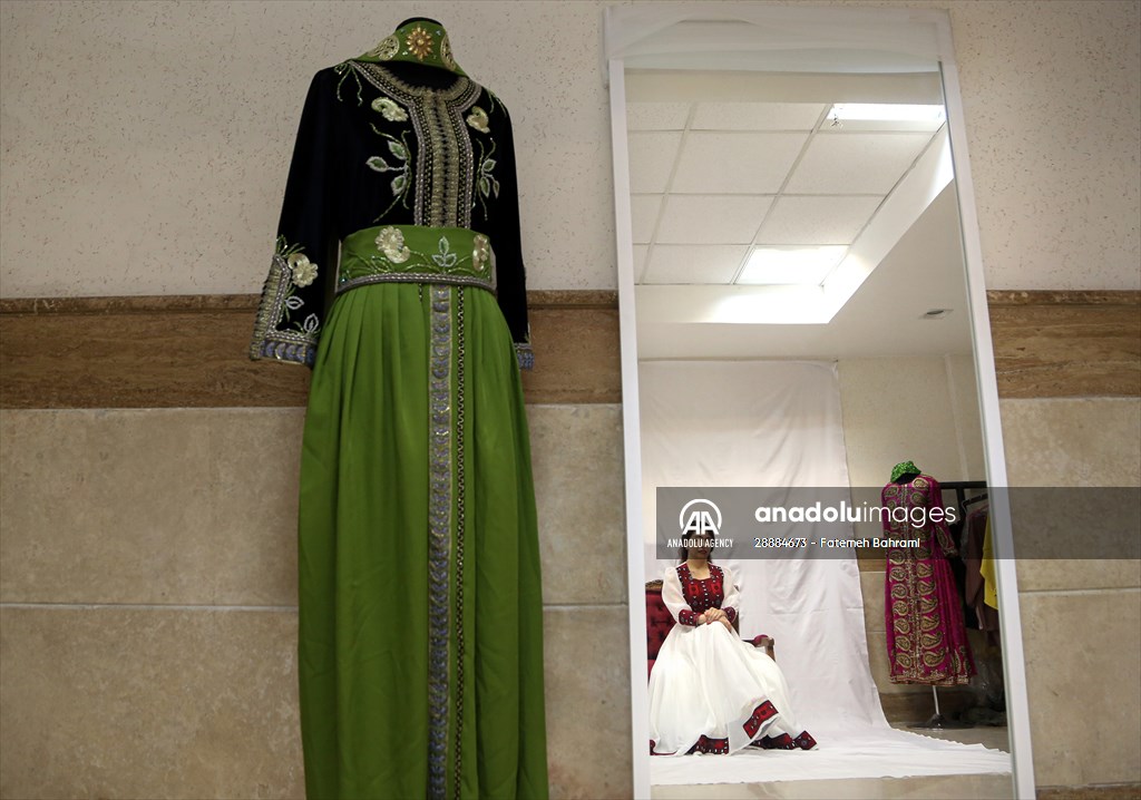 Acid attack victims model for Iranian fashion designer