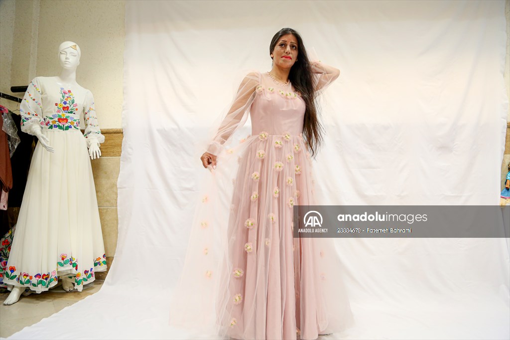 Acid attack victims model for Iranian fashion designer