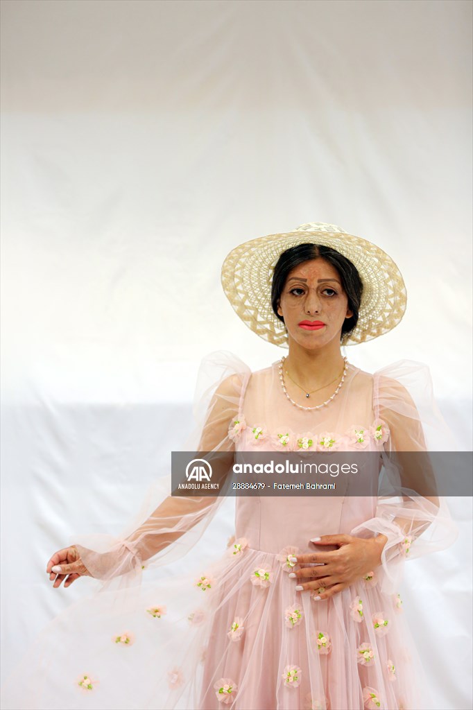 Acid attack victims model for Iranian fashion designer