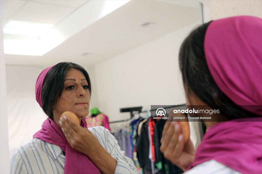 Acid attack victims model for Iranian fashion designer