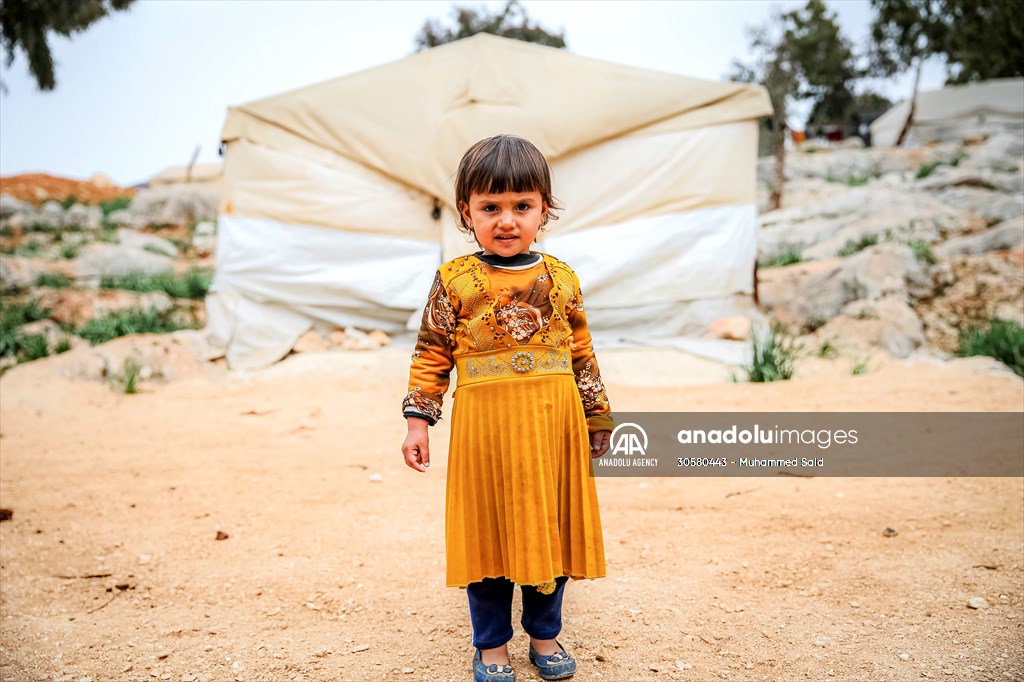 Syrian children after 12th anniversary of the Syrian Civil War at the tent city in Idlib