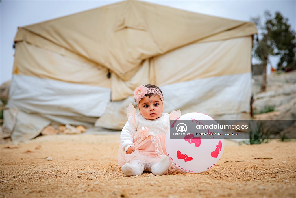 Syrian children after 12th anniversary of the Syrian Civil War at the tent city in Idlib