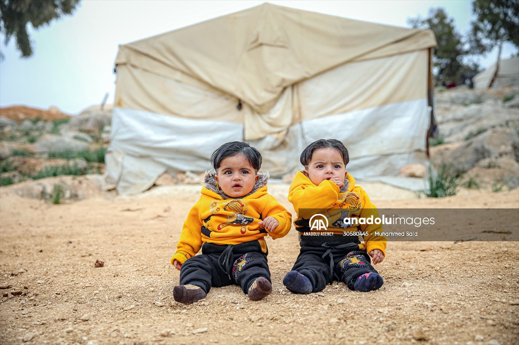 Syrian children after 12th anniversary of the Syrian Civil War at the tent city in Idlib