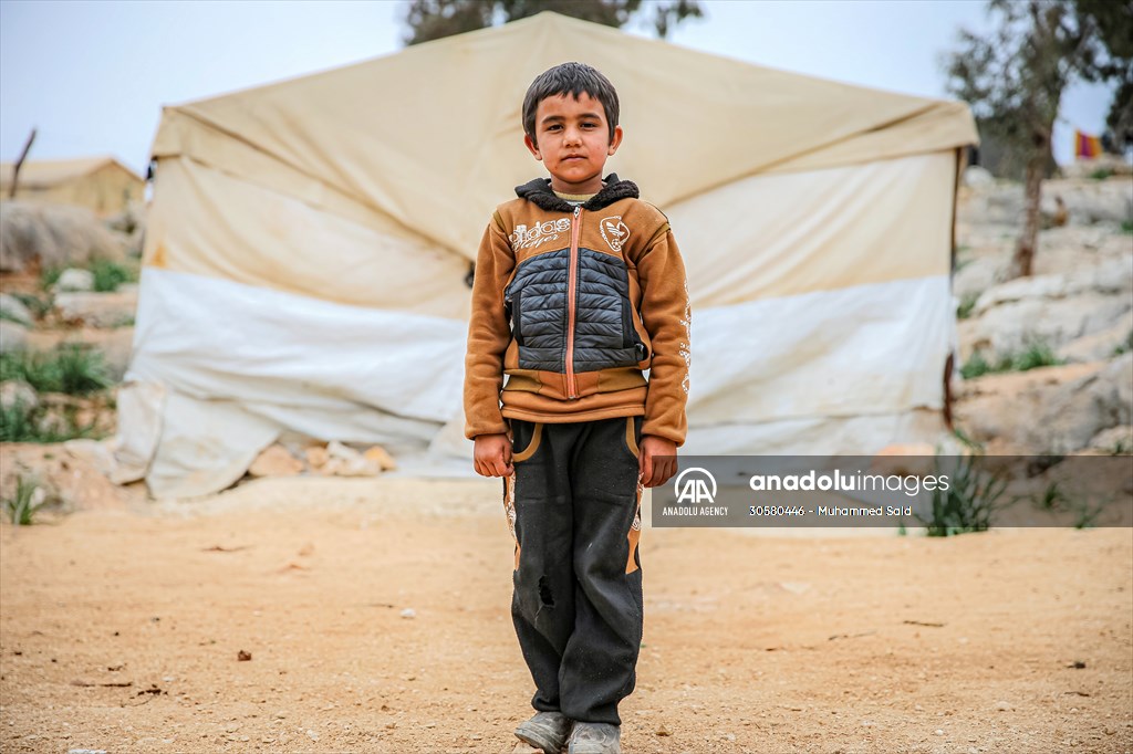 Syrian children after 12th anniversary of the Syrian Civil War at the tent city in Idlib