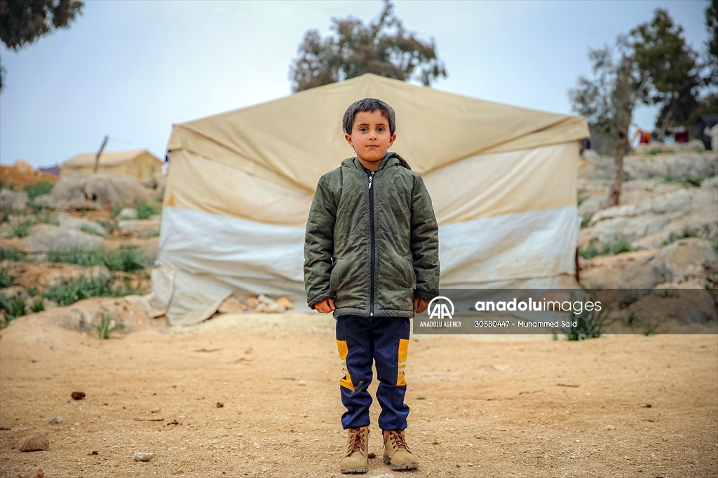 Syrian children after 12th anniversary of the Syrian Civil War at the tent city in Idlib