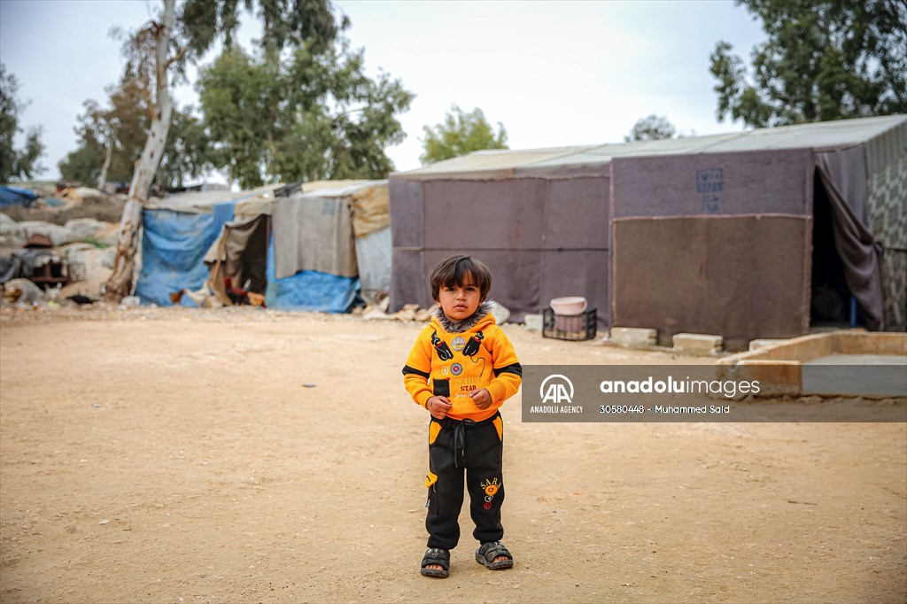 Syrian children after 12th anniversary of the Syrian Civil War at the tent city in Idlib