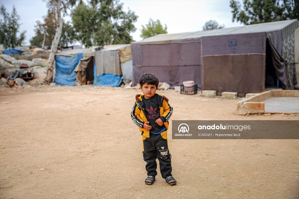 Syrian children after 12th anniversary of the Syrian Civil War at the tent city in Idlib