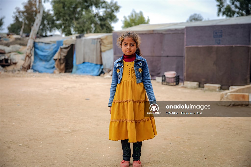 Syrian children after 12th anniversary of the Syrian Civil War at the tent city in Idlib