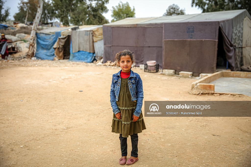 Syrian children after 12th anniversary of the Syrian Civil War at the tent city in Idlib