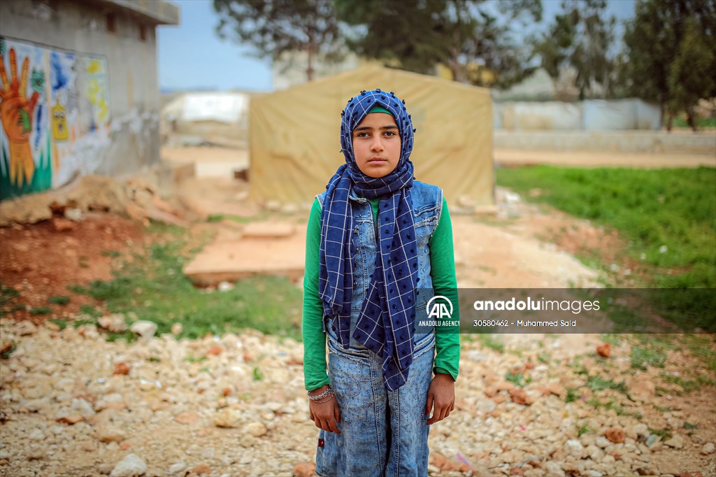 Syrian children after 12th anniversary of the Syrian Civil War at the tent city in Idlib