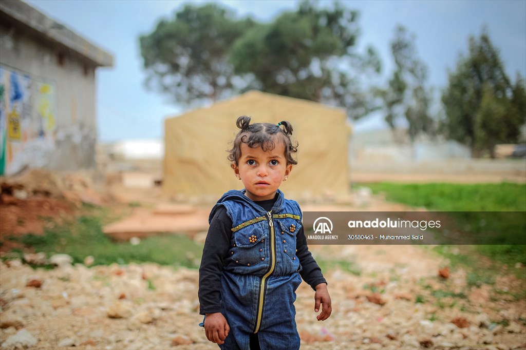 Syrian children after 12th anniversary of the Syrian Civil War at the tent city in Idlib