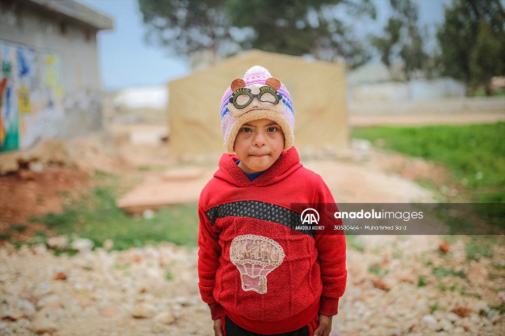 Syrian children after 12th anniversary of the Syrian Civil War at the tent city in Idlib