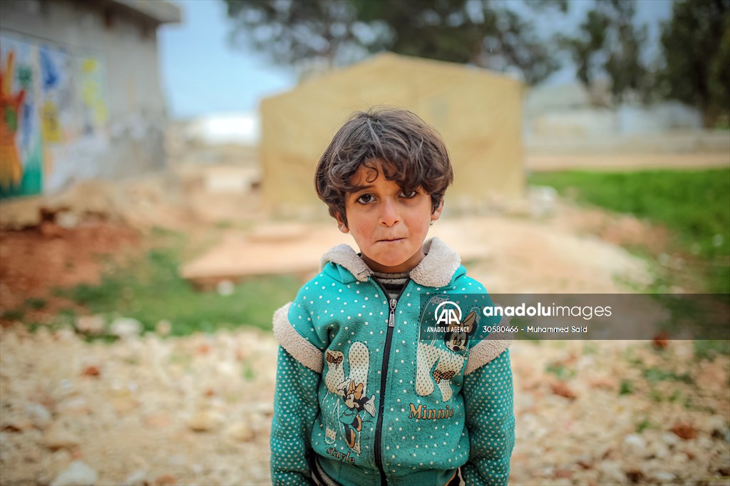 Syrian children after 12th anniversary of the Syrian Civil War at the tent city in Idlib