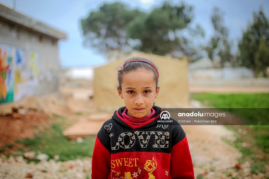 Syrian children after 12th anniversary of the Syrian Civil War at the tent city in Idlib