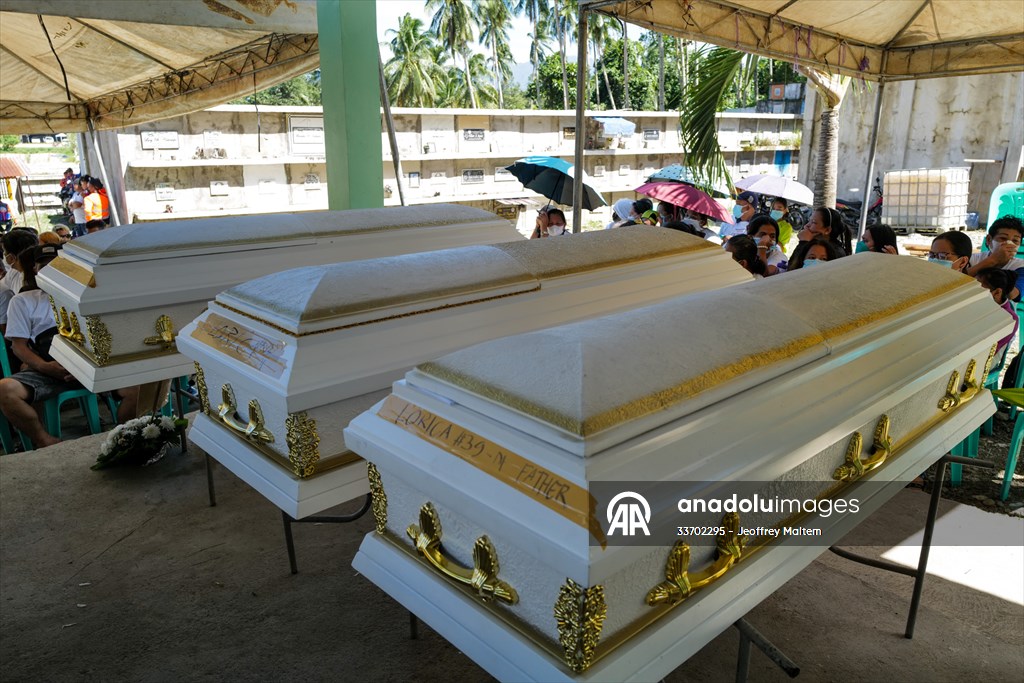 Mass burial ceremony for landslide victims in Philippines