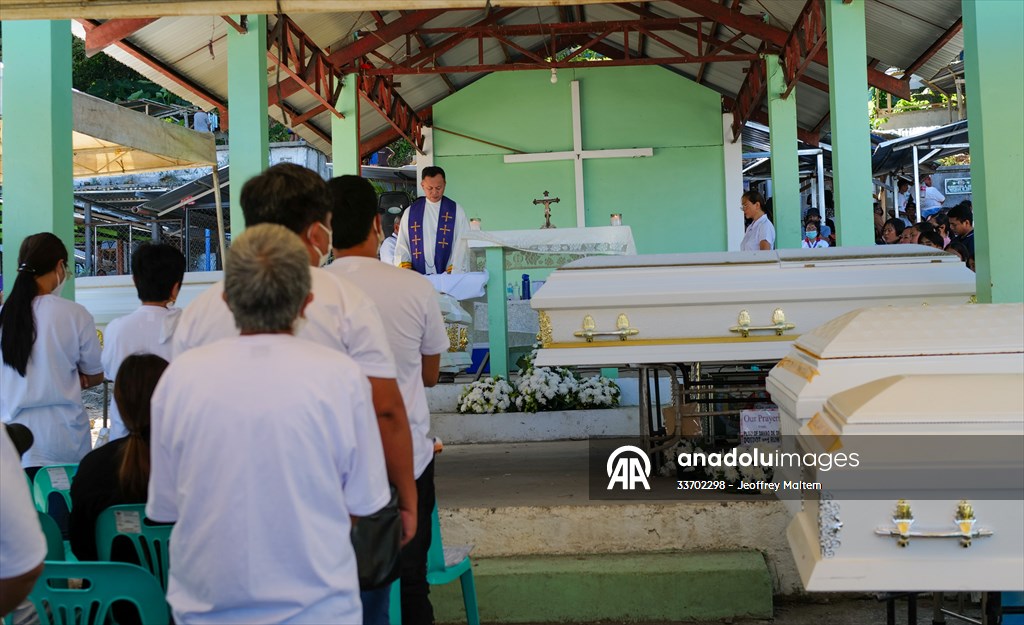 Mass burial ceremony for landslide victims in Philippines