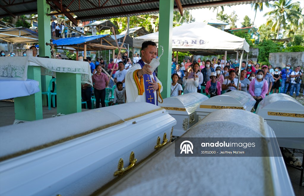 Mass burial ceremony for landslide victims in Philippines