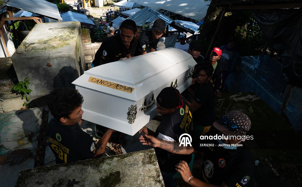 Mass burial ceremony for landslide victims in Philippines