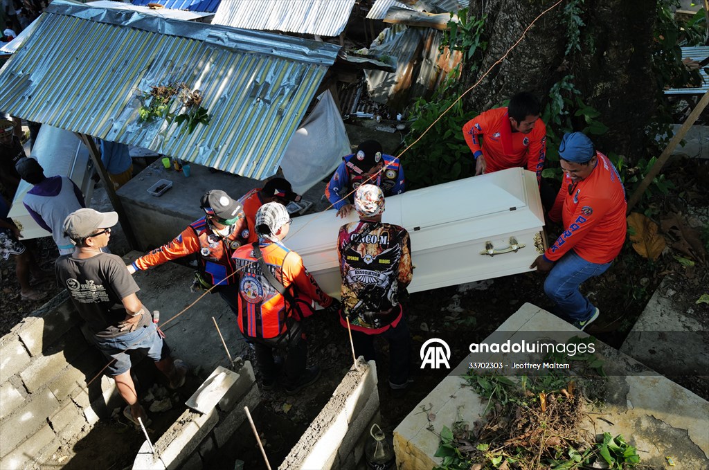 Mass burial ceremony for landslide victims in Philippines