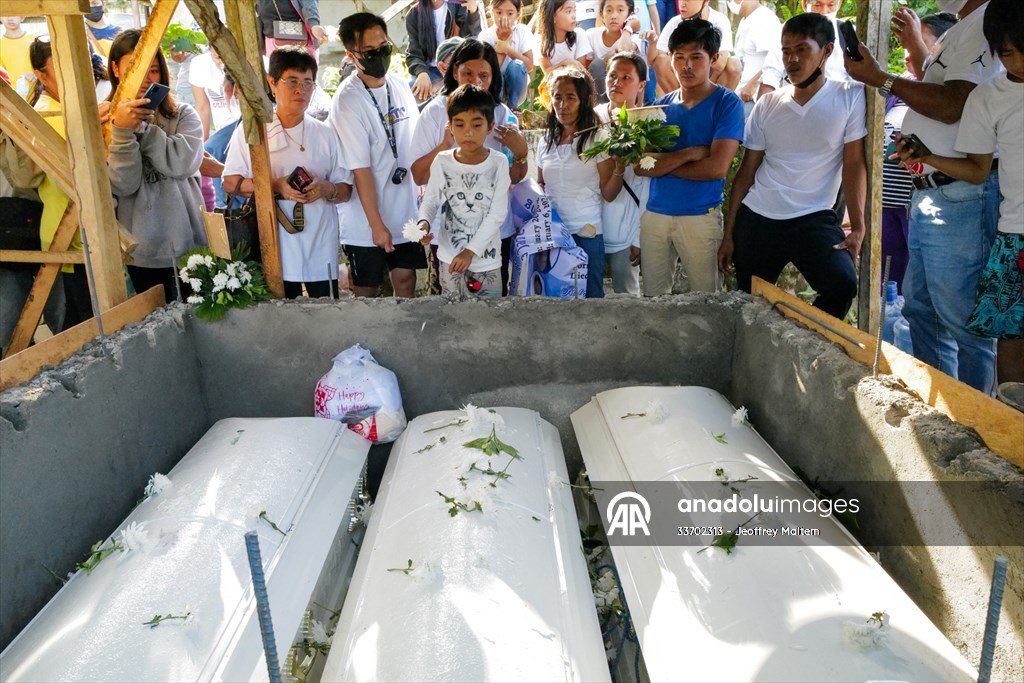 Mass burial ceremony for landslide victims in Philippines