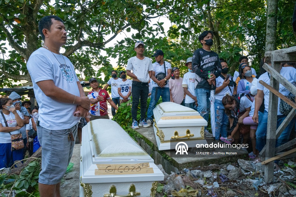 Mass burial ceremony for landslide victims in Philippines