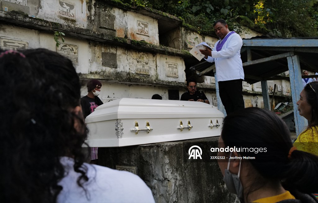 Mass burial ceremony for landslide victims in Philippines