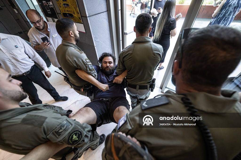 Israeli demonstrators demand Berlin administration cut arms exports to Israel in Tel Aviv