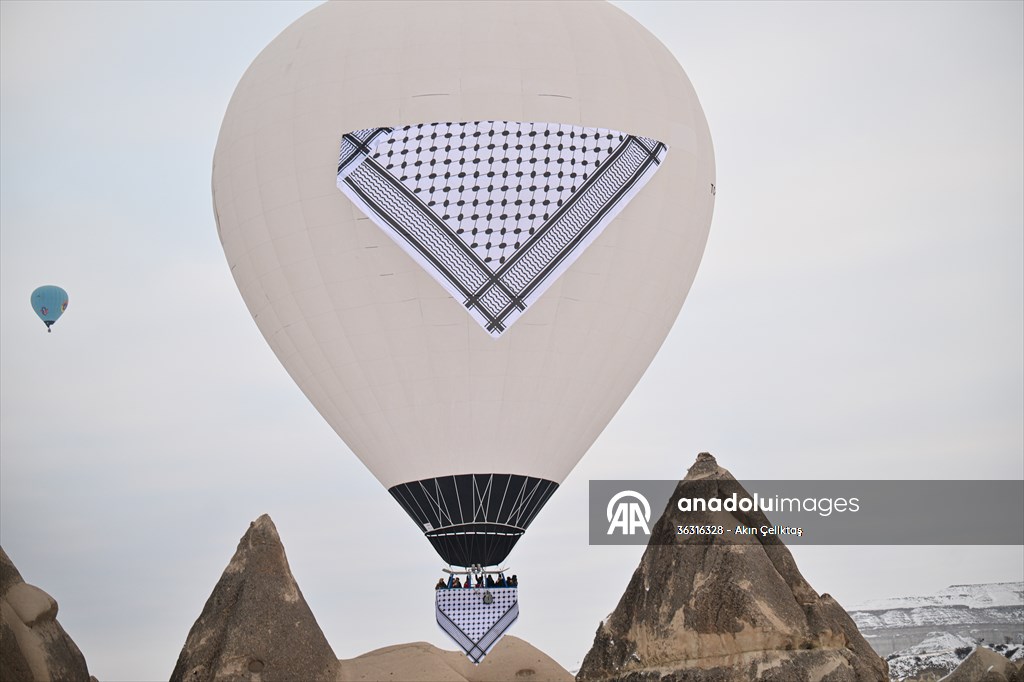 Hot air balloons with 'Palestinian keffiyeh' pattern rise above Cappadocia