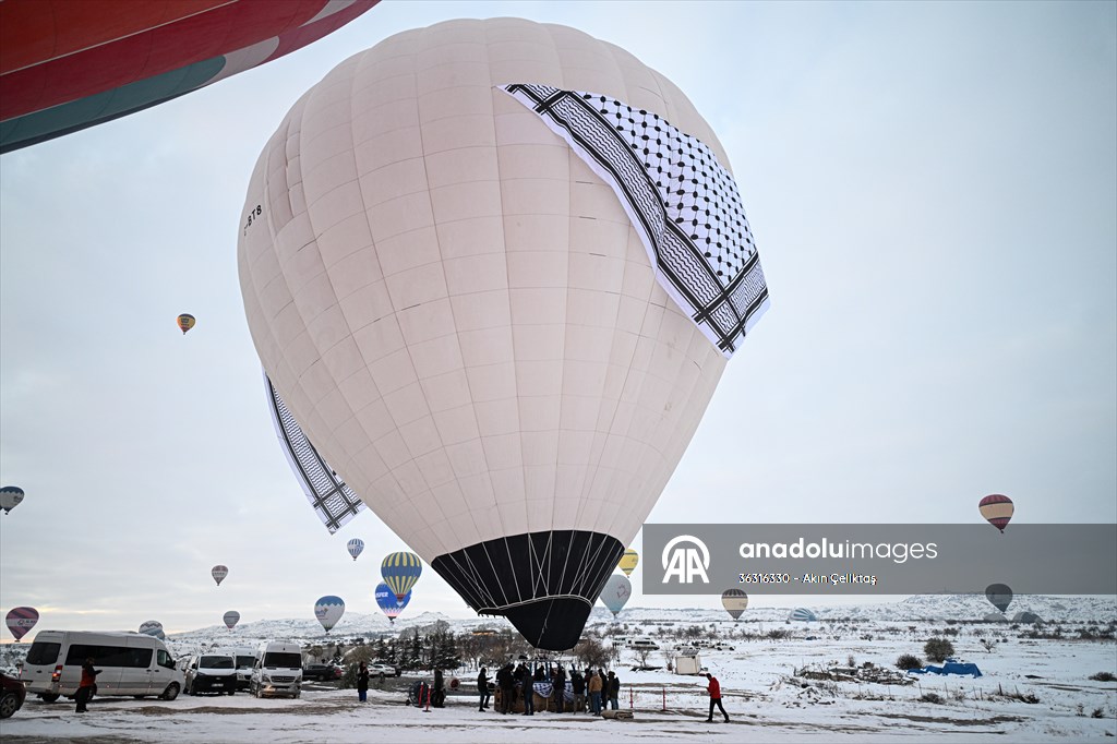 Hot air balloons with 'Palestinian keffiyeh' pattern rise above Cappadocia