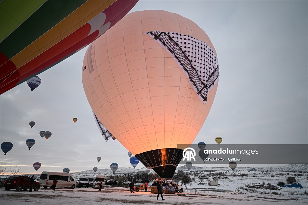 Hot air balloons with 'Palestinian keffiyeh' pattern rise above Cappadocia