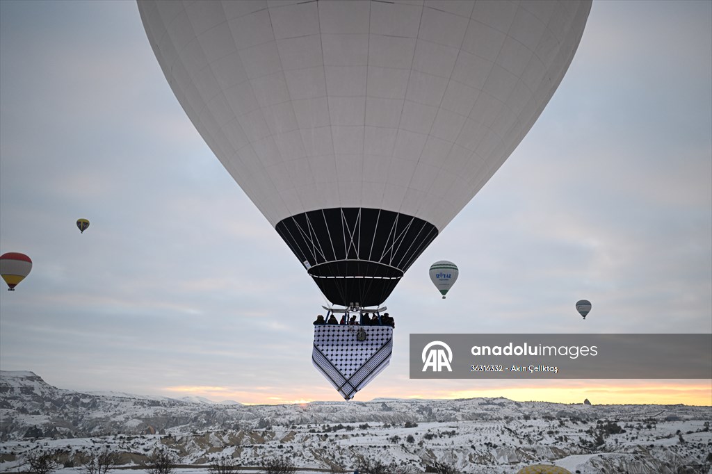 Hot air balloons with 'Palestinian keffiyeh' pattern rise above Cappadocia