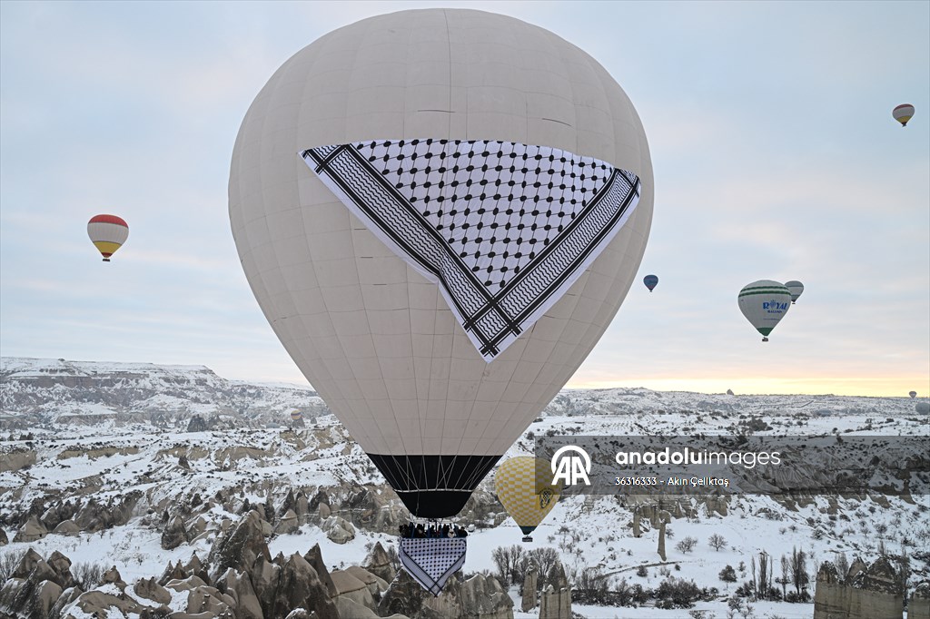 Hot air balloons with 'Palestinian keffiyeh' pattern rise above Cappadocia