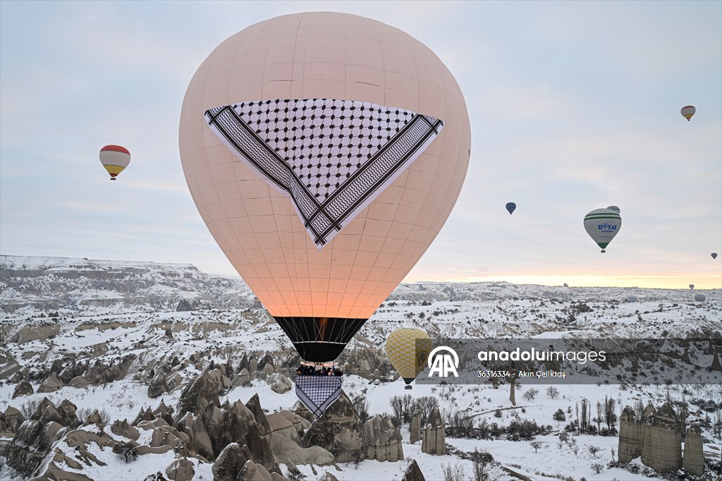 Hot air balloons with 'Palestinian keffiyeh' pattern rise above Cappadocia