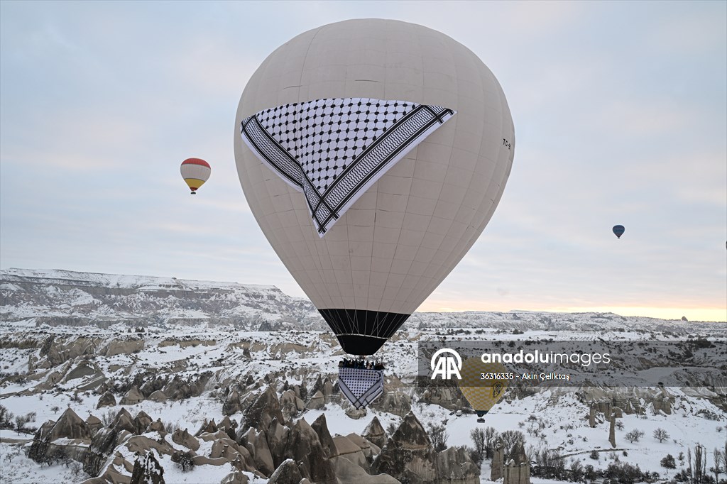 Hot air balloons with 'Palestinian keffiyeh' pattern rise above Cappadocia