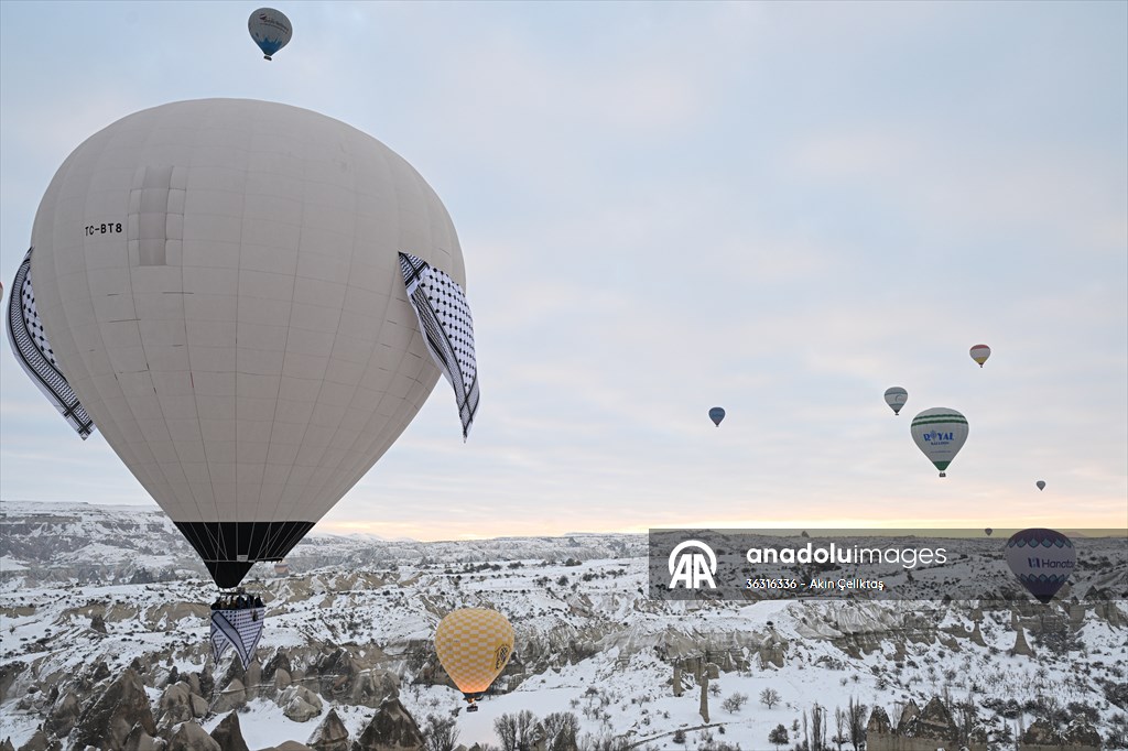 Hot air balloons with 'Palestinian keffiyeh' pattern rise above Cappadocia
